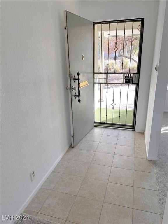 entryway featuring light tile patterned floors