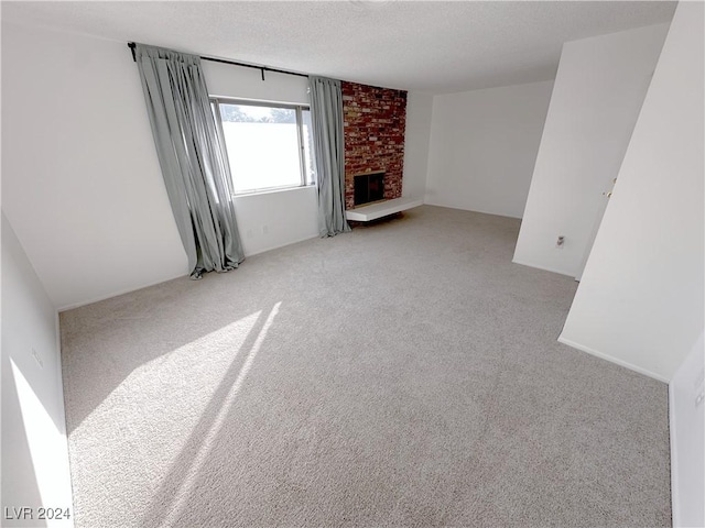 unfurnished living room featuring light colored carpet and a brick fireplace