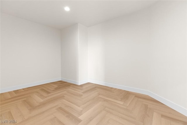 empty room with parquet flooring