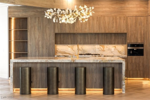 bar featuring oven and light parquet flooring