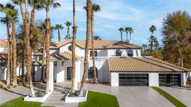 mediterranean / spanish-style house featuring a garage