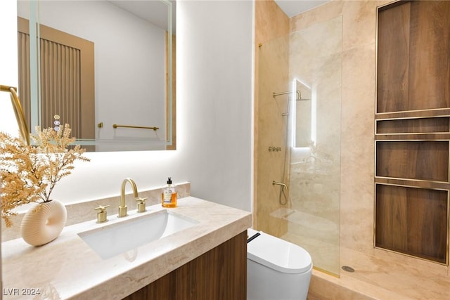 bathroom with tiled shower, toilet, and vanity