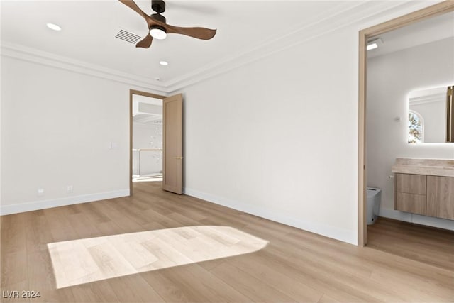 unfurnished bedroom with light wood-type flooring, ceiling fan, ornamental molding, and ensuite bath