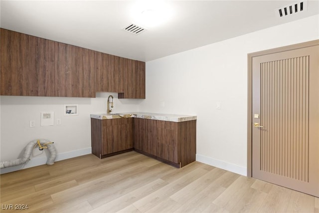 kitchen featuring sink and light hardwood / wood-style floors