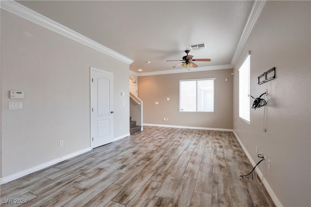 unfurnished living room with ceiling fan, crown molding, and light hardwood / wood-style floors