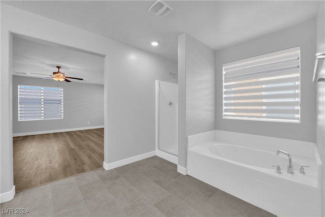 bathroom featuring separate shower and tub, ceiling fan, and hardwood / wood-style floors