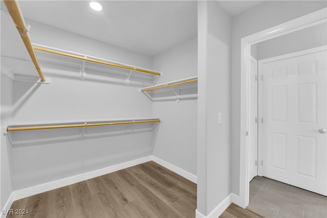 walk in closet featuring hardwood / wood-style floors