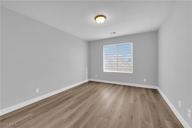 spare room with light wood-type flooring