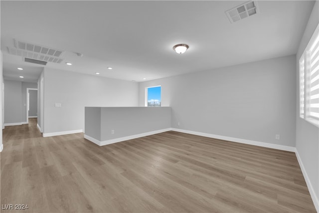 unfurnished room featuring light hardwood / wood-style floors