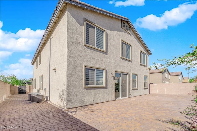 back of house with a patio area