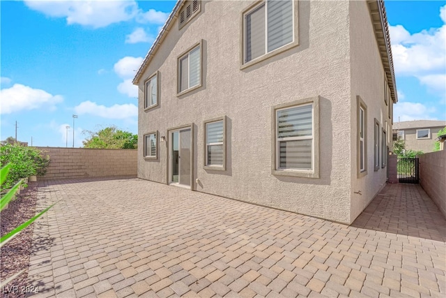 rear view of property with a patio area