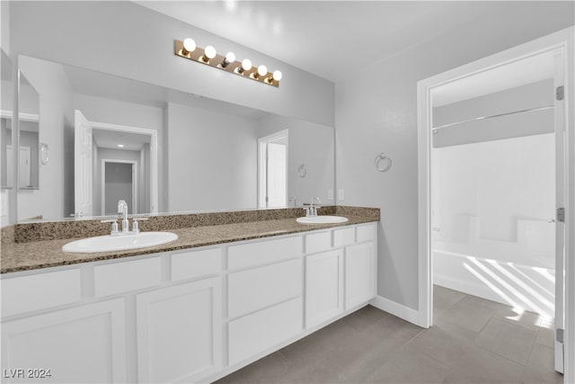 bathroom featuring tile patterned flooring and vanity