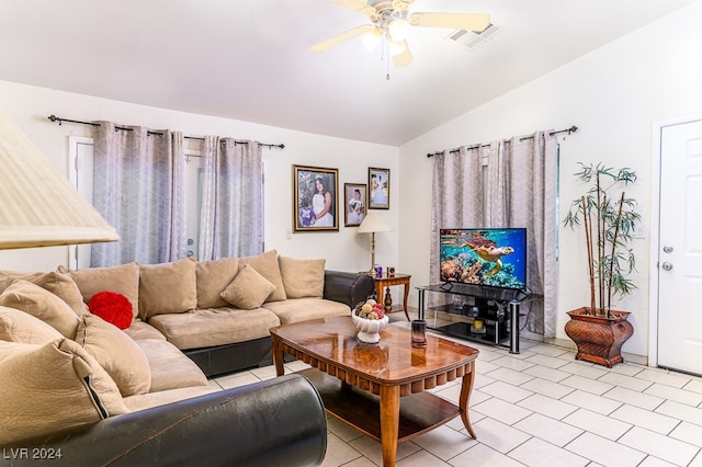 living room featuring ceiling fan and vaulted ceiling