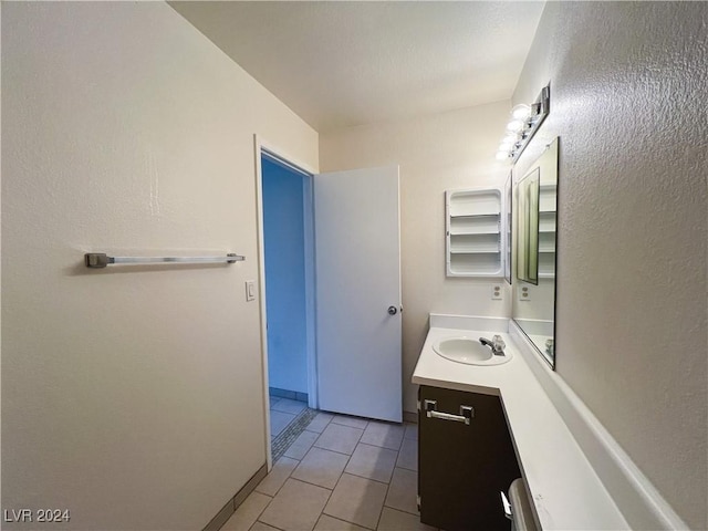 bathroom with tile patterned floors and vanity