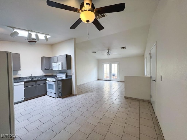 kitchen featuring sink, white appliances, gray cabinetry, light tile patterned flooring, and french doors