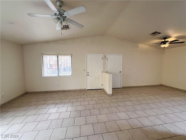 spare room with ceiling fan and lofted ceiling