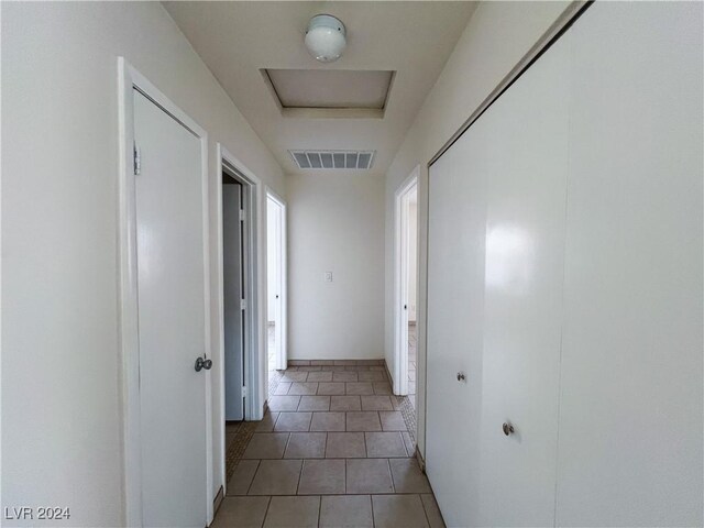 corridor with tile patterned floors