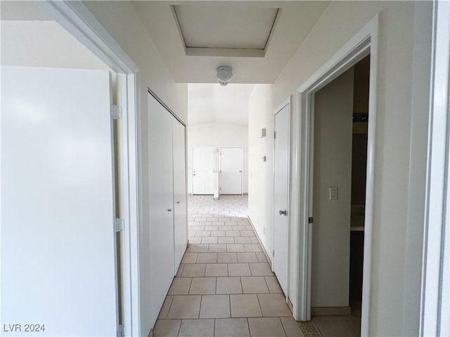 corridor with light tile patterned flooring