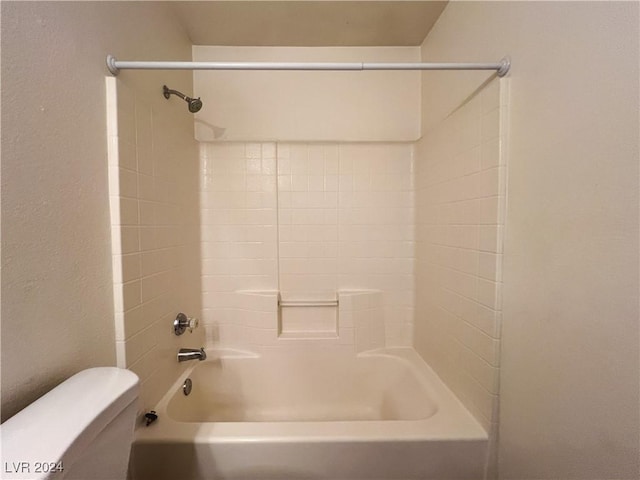 bathroom featuring shower / washtub combination and toilet