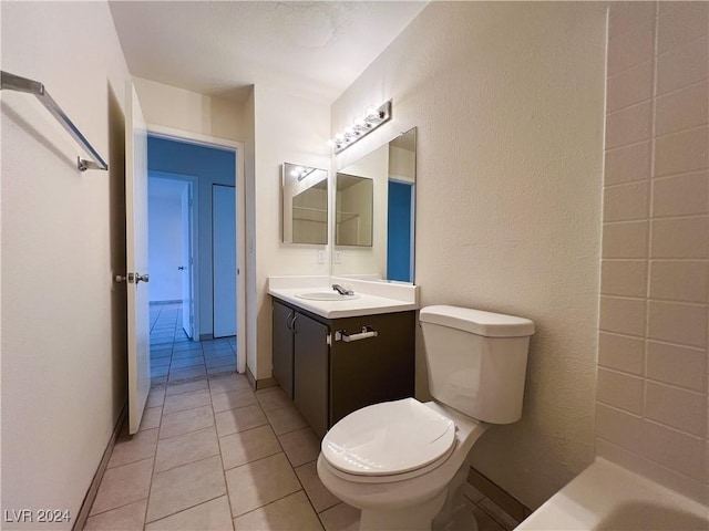 bathroom with vanity, tile patterned floors, and toilet