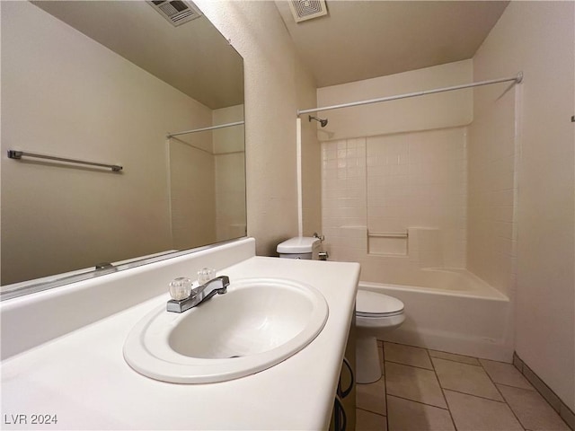 full bathroom featuring vanity, tile patterned floors, washtub / shower combination, and toilet