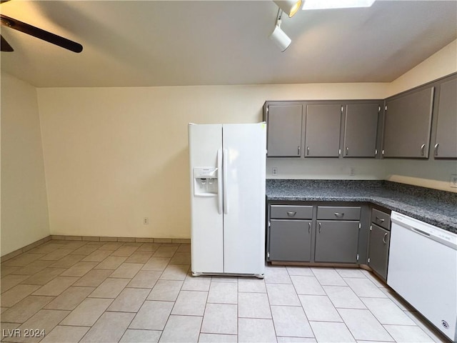 kitchen with white appliances, gray cabinets, ceiling fan, and light tile patterned flooring