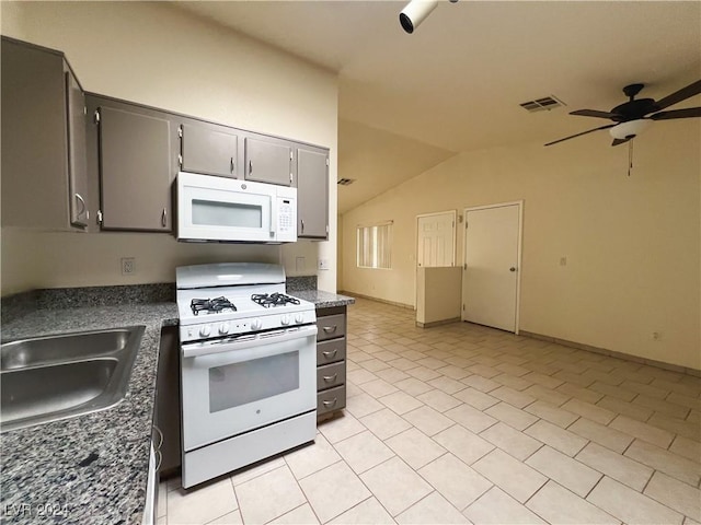 kitchen with lofted ceiling, sink, white appliances, gray cabinets, and ceiling fan