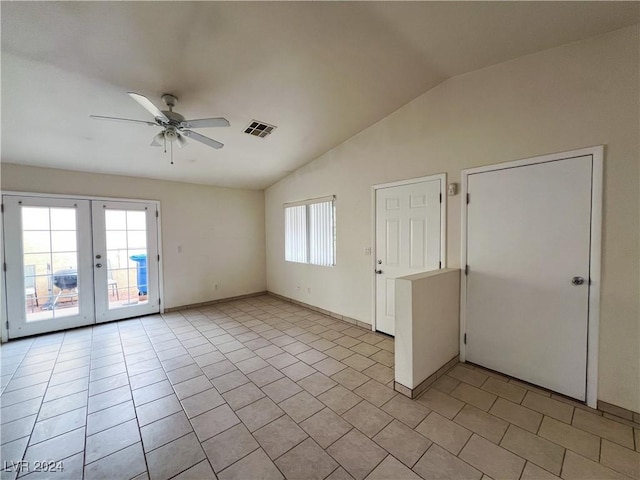 spare room featuring french doors, ceiling fan, lofted ceiling, and light tile patterned floors