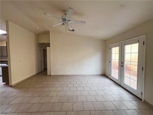 unfurnished room with vaulted ceiling, ceiling fan, and french doors