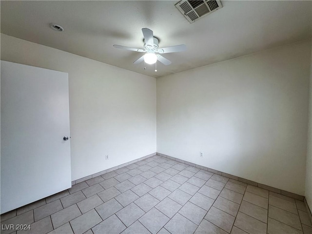 unfurnished room featuring ceiling fan and light tile patterned floors