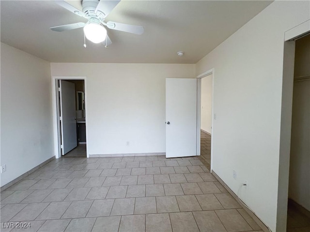 unfurnished bedroom featuring ceiling fan