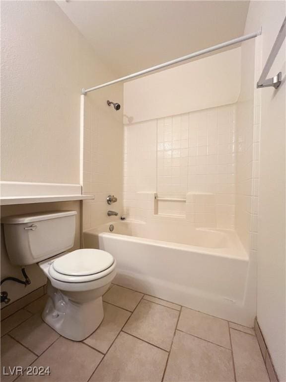 bathroom with tile patterned flooring, shower / bathtub combination, and toilet