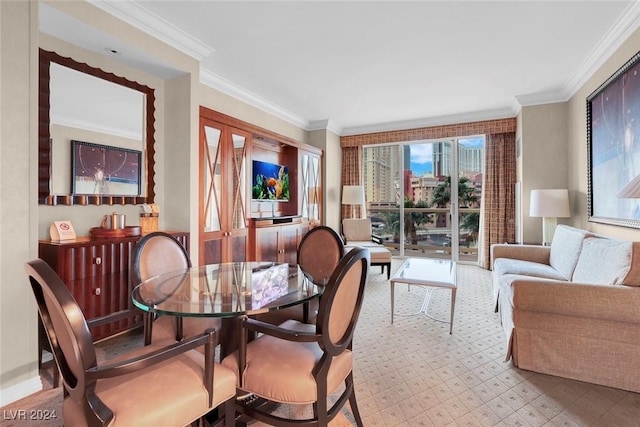 dining room featuring crown molding