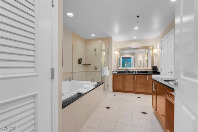 bathroom featuring separate shower and tub, tile patterned flooring, and vanity