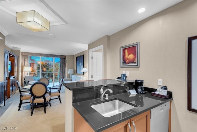 kitchen featuring white dishwasher, kitchen peninsula, sink, and ornamental molding