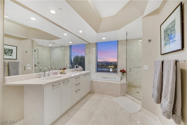 bathroom featuring tile patterned floors, independent shower and bath, and vanity