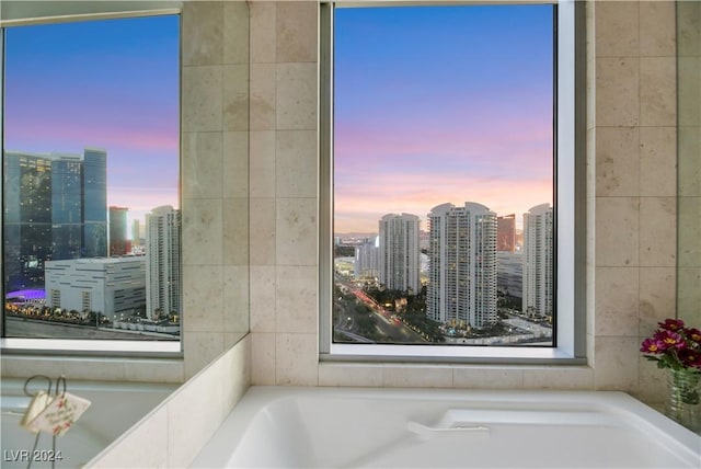 bathroom with a tub to relax in