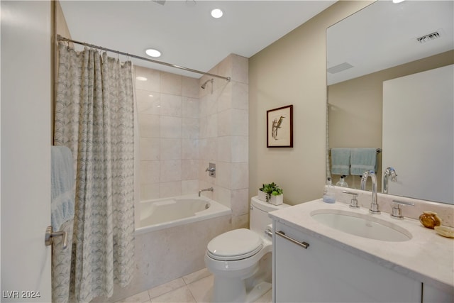 full bathroom featuring tile patterned floors, shower / bath combo, toilet, and vanity