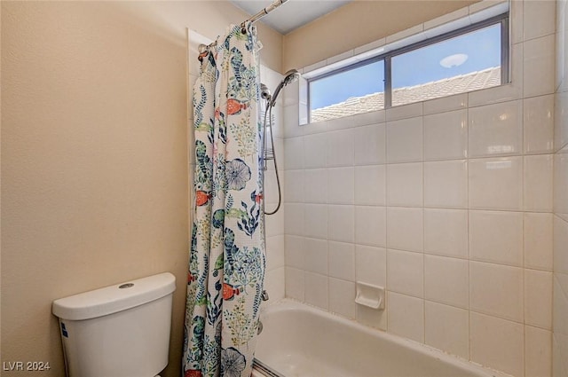 bathroom with toilet and shower / bath combo with shower curtain