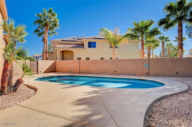 view of pool with a fenced in pool, a fenced backyard, and a patio