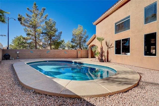 view of pool with a fenced backyard and a fenced in pool