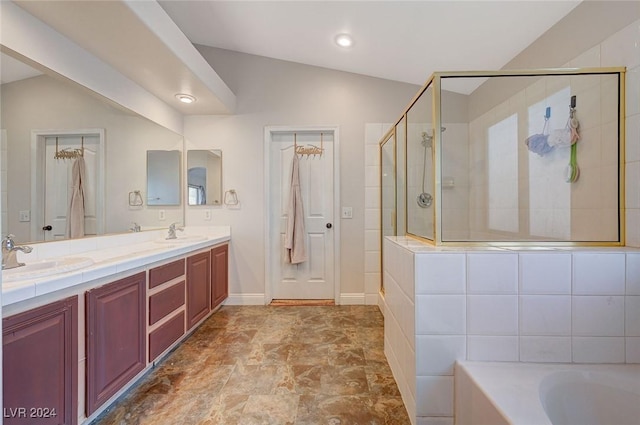 full bathroom with double vanity, a stall shower, a sink, and a bathing tub