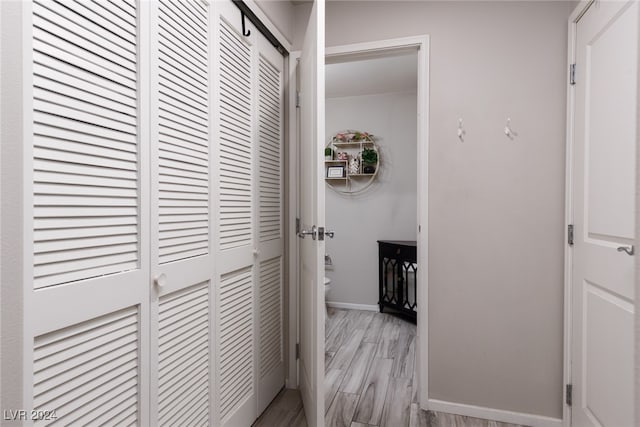 corridor featuring light hardwood / wood-style floors