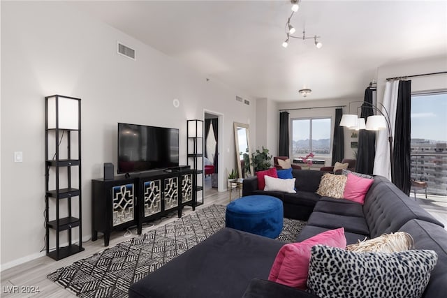 living room with light hardwood / wood-style flooring