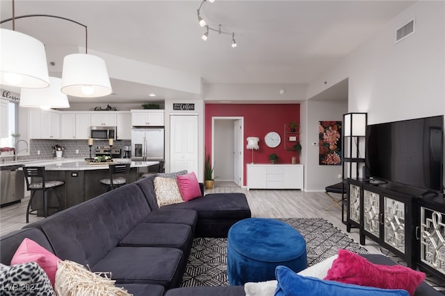 living room featuring light wood-type flooring