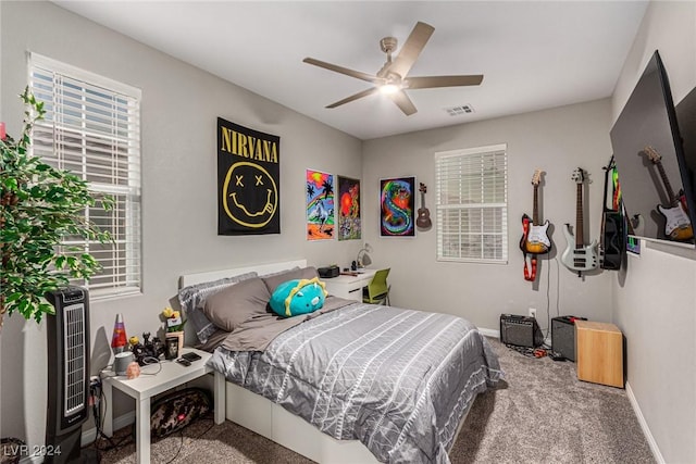 bedroom featuring ceiling fan, carpet flooring, and heating unit