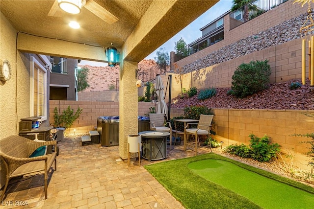 view of patio featuring ceiling fan