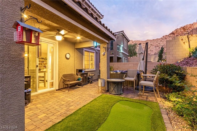 view of patio terrace at dusk