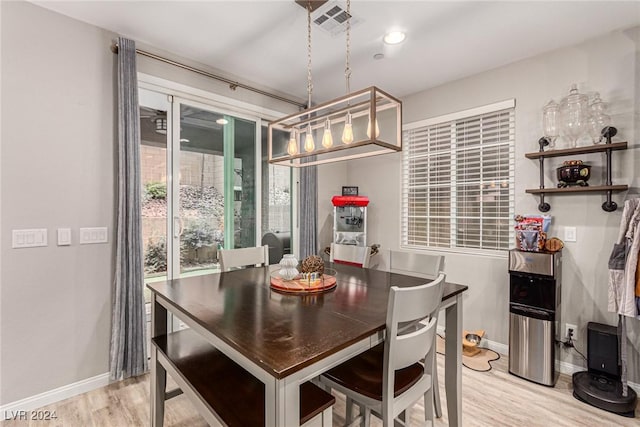 dining space featuring light wood-type flooring