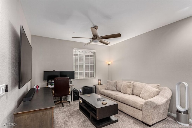 carpeted living room featuring ceiling fan